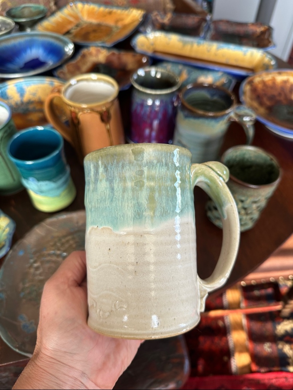 Large handmade pottery coffee cup. Off white and sea foam green. Munising, MI